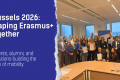 The visual shows the title Brussels 2026: Shaping Erasmus+ Together and subtitle: Students, alumni, and institutions building the future of mobility. The background is dark blue and on the right there is a picture of a lot of people together